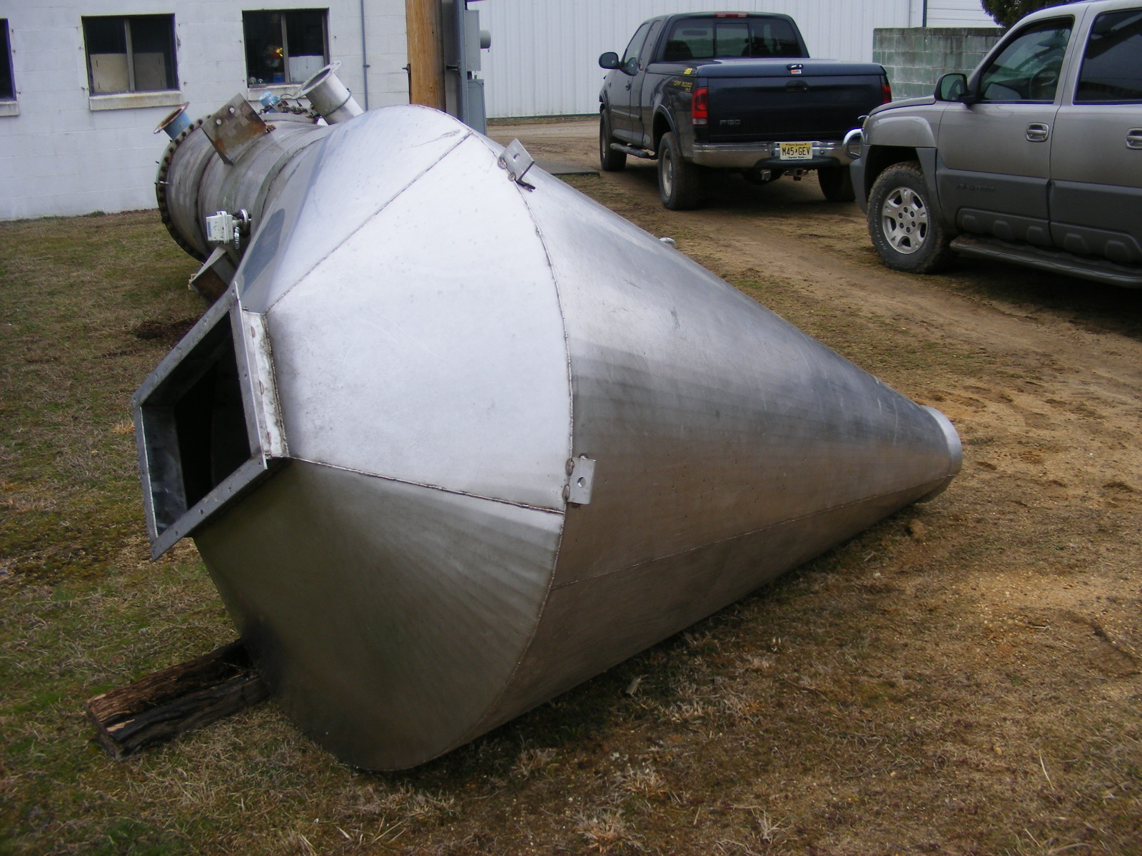 used stainless steel feed hopper, approx. 35 cuft. (260 gallon).  5' diameter at widest point x 7'2